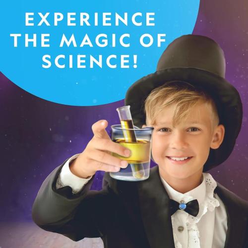 Boy experiencing the magic of science with the National Geographic Science Magic Kit, wearing a magician's hat and holding a test tube.